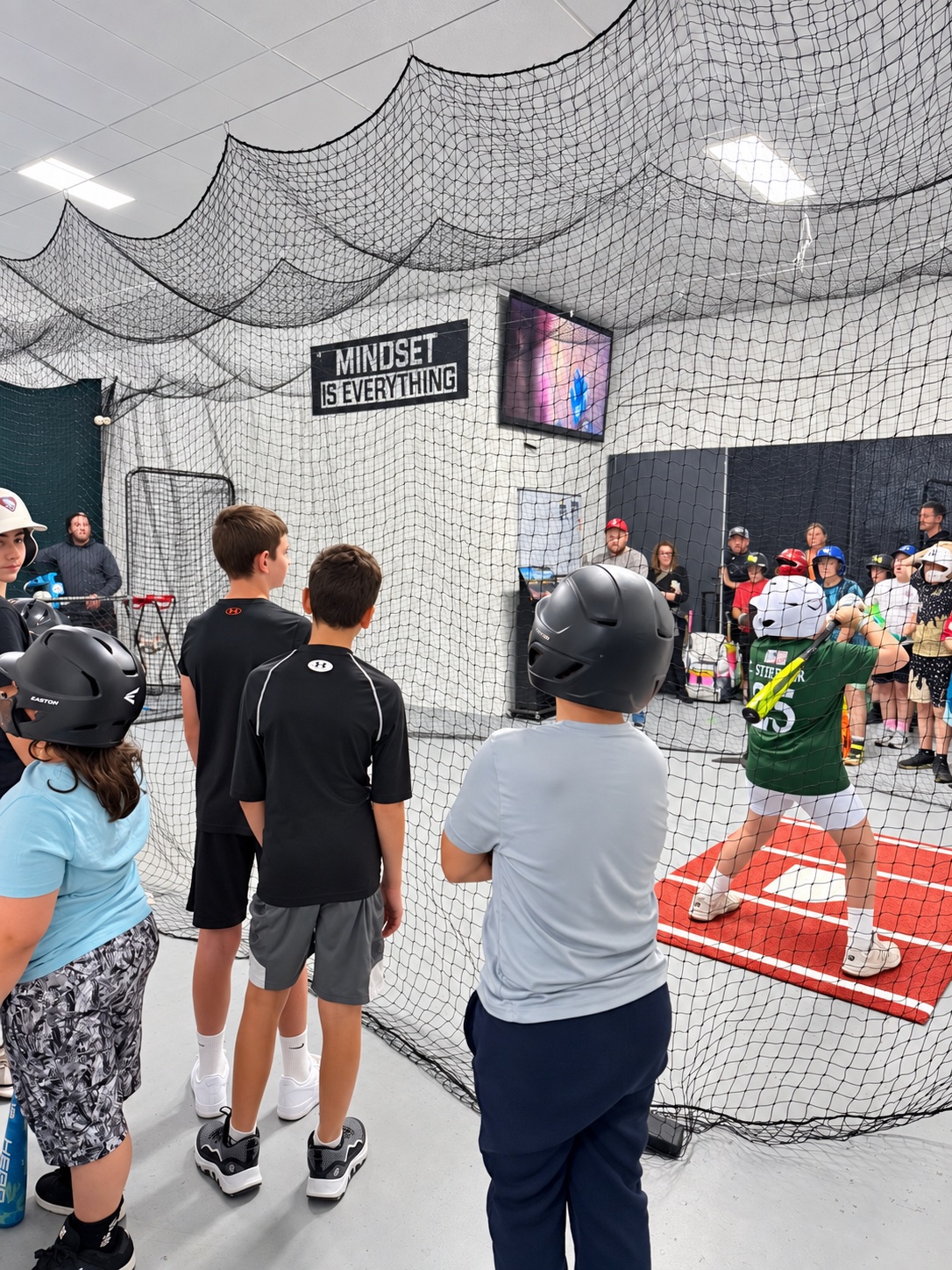 A young player taking an at-bat at Trackside
